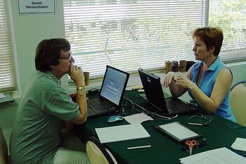 THAILAND 2005: Sigrid I. Kvaal (left) is comparing teeth with dental records, for the victims of the tsunami in Thailand. Here she is cooperating with Sinnika Syrjelainen from Finland.